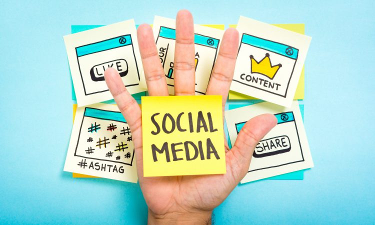 Social,Media,On,Hand,With,Blue,Background.,Content,Marketing.